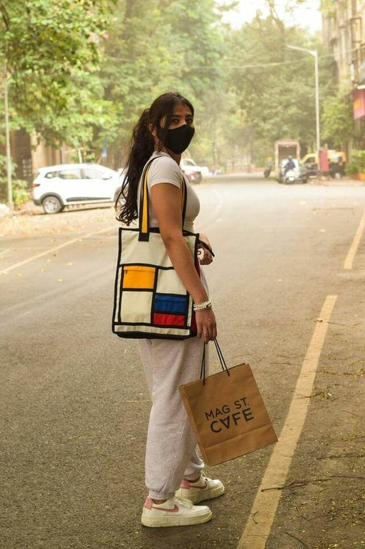 Versatile Kilte Tote Bag - Ideal for Travel and Everyday Use" Alt text: "Side view of the Kilte tote bag, emphasizing its versatility for both travel and everyday use. With its long and spacious design, this tote bag offers ample room to carry your belongings in style.