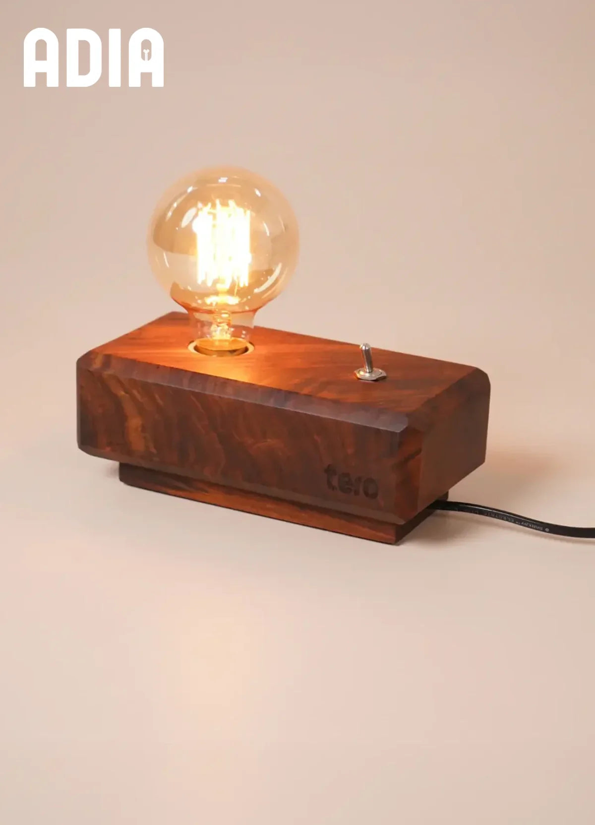 ADIA solid wood desk lamp side view showing retro toggle switch and natural wood grain
