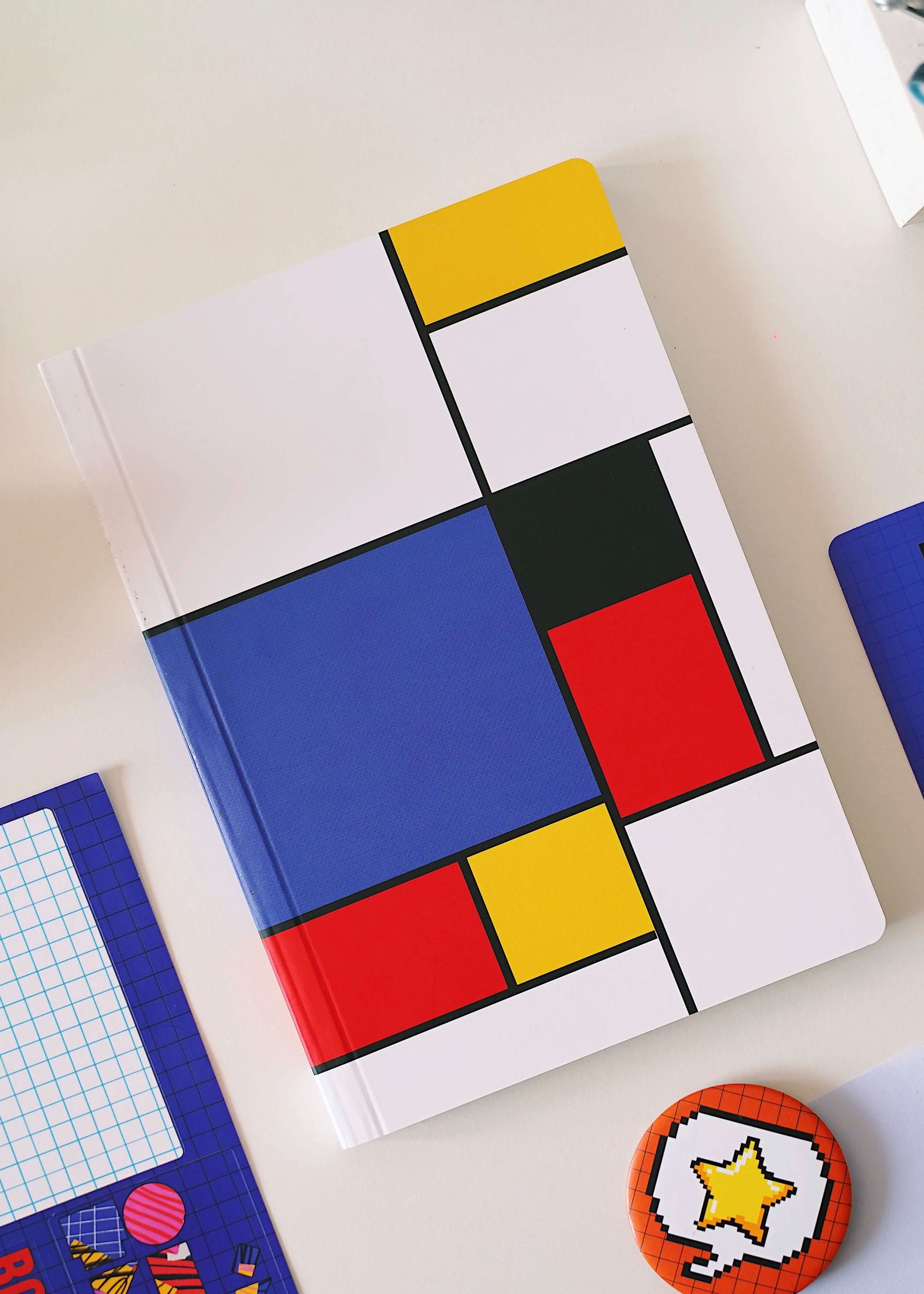Jack in the Block Premium Notebook featuring three different paper variants: ruled, plain, and mixed. The ruled paper variant offers lined pages for organized writing, the plain paper variant offers blank pages for freeform creativity, and the mixed paper variant combines both ruled and plain pages for flexible use. The notebook is of high quality, featuring a sturdy cover and designed for long-lasting use. Perfect for students, professionals, or anyone who loves to write and draw