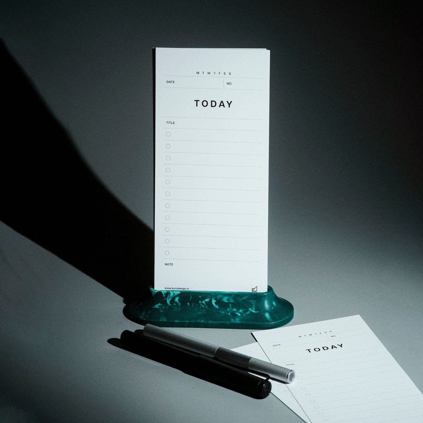 Aero Task Dock lifestyle shot – handcrafted Jesmonite phone and task card holder for focused work